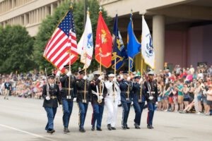 flags of all military branches in a parade