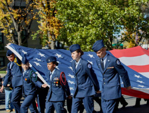 rotc marching in a veteran's day parade