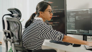 young woman writing code