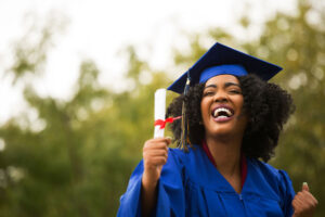 happy grad with diploma