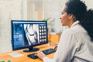 radiologist at her computer