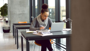 student taking notes